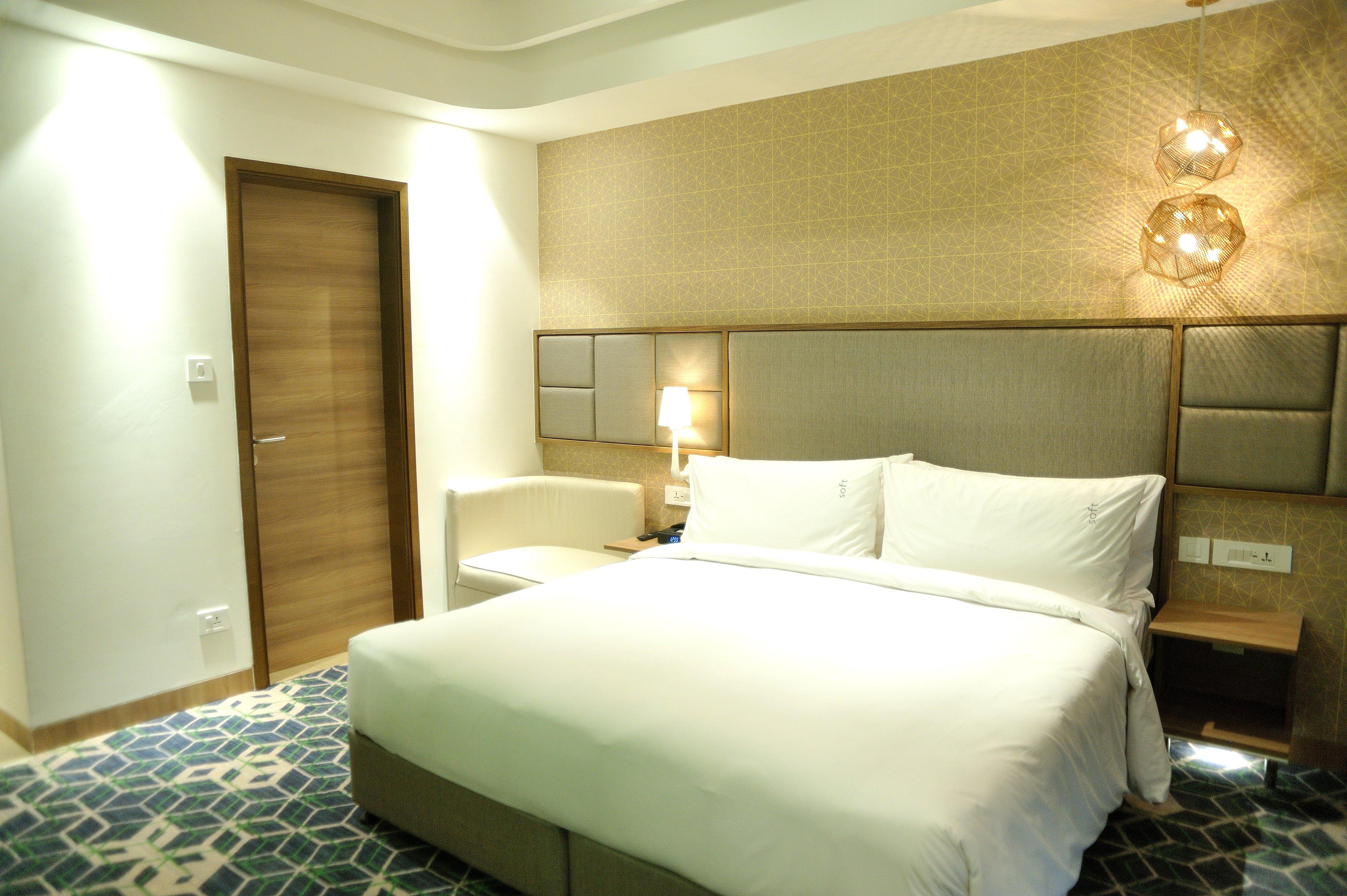 ホリデー イン グルグラム セクター 90 グルガウン エクステリア 写真 A bedroom at the hotel
