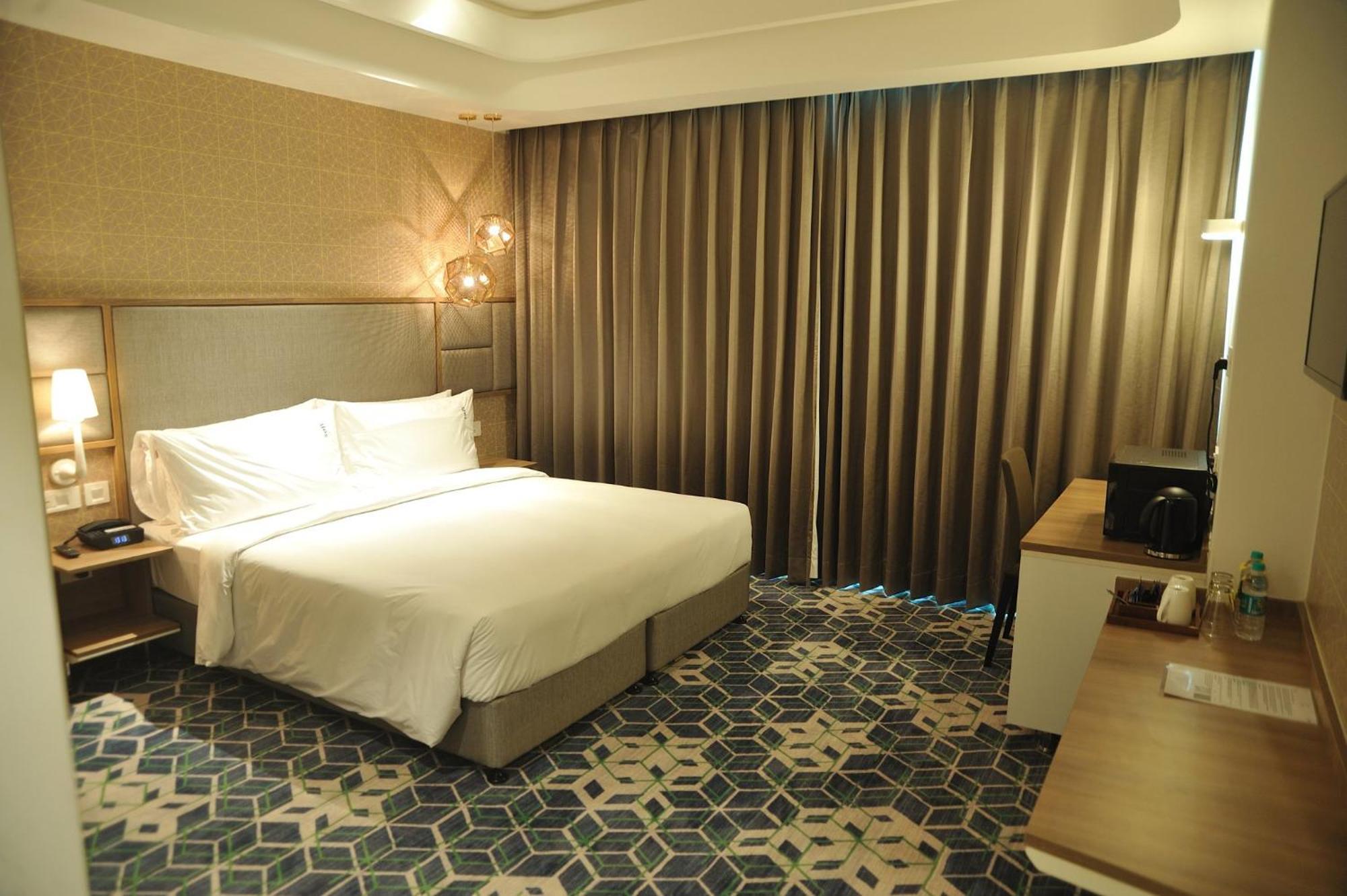 ホリデー イン グルグラム セクター 90 グルガウン エクステリア 写真 A room at the hotel